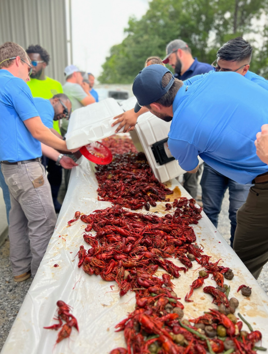 C/SHarpe employees enjoy a company crawfish boil
